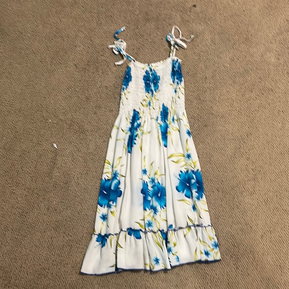 a floral dress, bought in hawaii, worn 3 times, a early teen or tween dress
